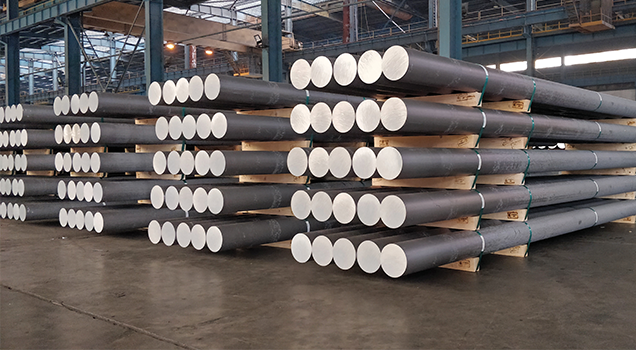 Aluminium billets stacked in a warehouse